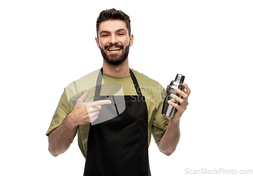 Image of happy barman with shaker preparing