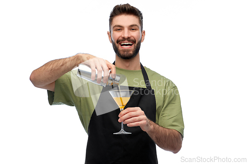 Image of happy barman with shaker and glass preparing drink