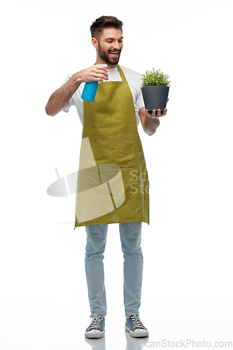 Image of happy smiling male gardener moisturizing flower