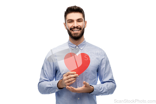 Image of happy smiling young man with red heart