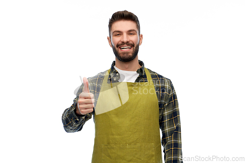 Image of happy male gardener or farmer showing thumbs up