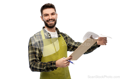 Image of happy male gardener with clipboard