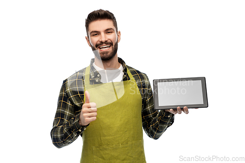 Image of happy male farmer with tablet pc showing thumbs up