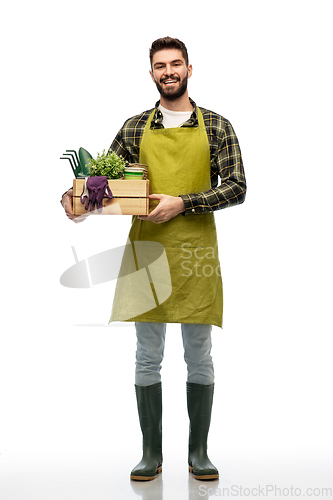 Image of happy gardener or farmer with box of garden tools