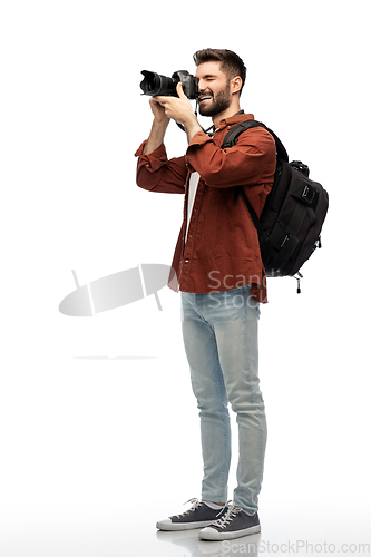 Image of happy man or photographer with camera and backpack