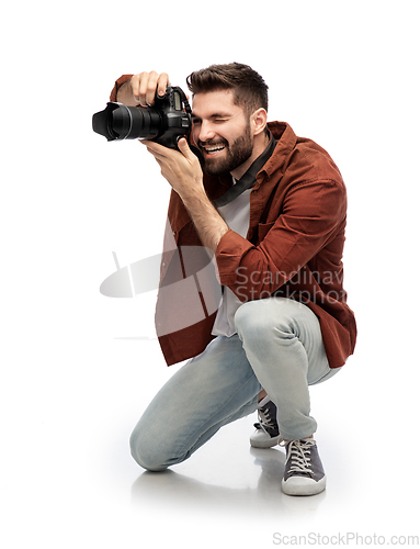 Image of smiling man or photographer with digital camera