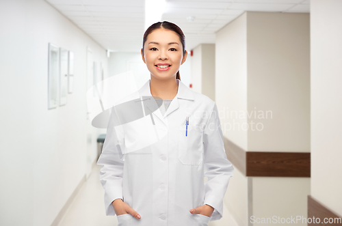 Image of happy smiling asian female doctor at hospital