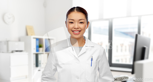 Image of happy smiling asian female doctor at hospital