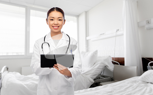 Image of asian female doctor with tablet pc at hospital