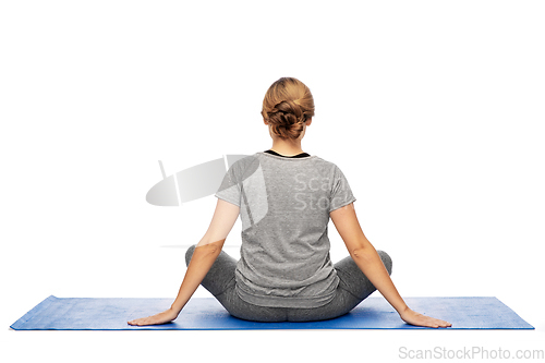 Image of woman doing yoga on mat