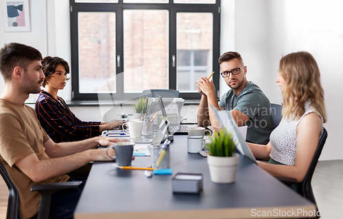 Image of team of startuppers meeting at office