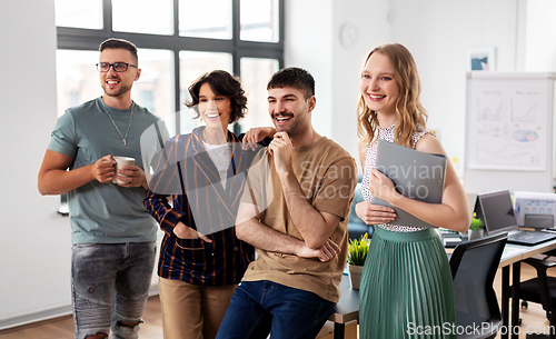 Image of happy business team at office