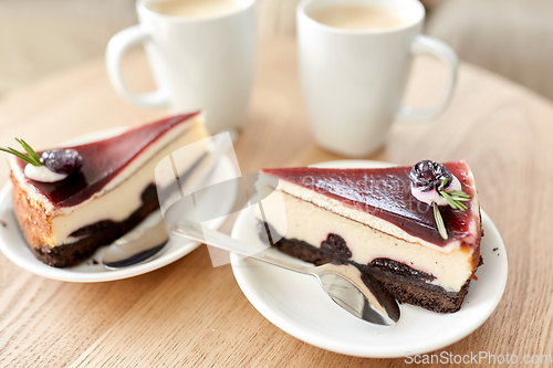 Image of piece of chocolate cake on wooden table