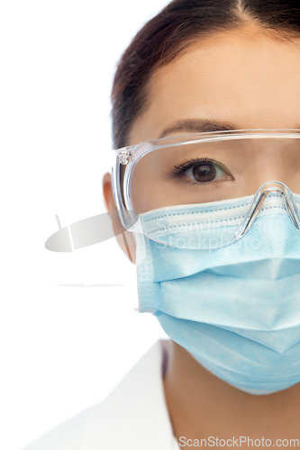 Image of asian female doctor or scientist in medical mask