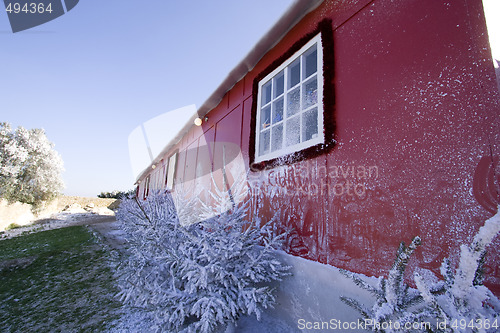 Image of winter red house