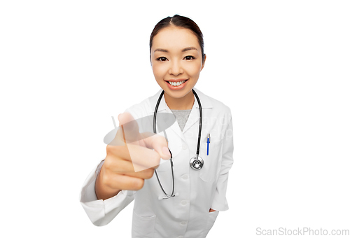 Image of happy asian female doctor pointing to camera