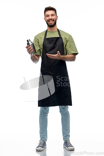 Image of happy barman in apron with shaker