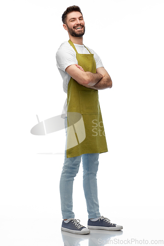 Image of happy barman or waiter in apron with crossed arms