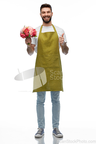 Image of happy male gardener with flowers showing thumbs up