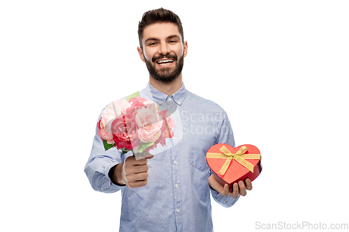 Image of happy man with flowers and valentine's day gift