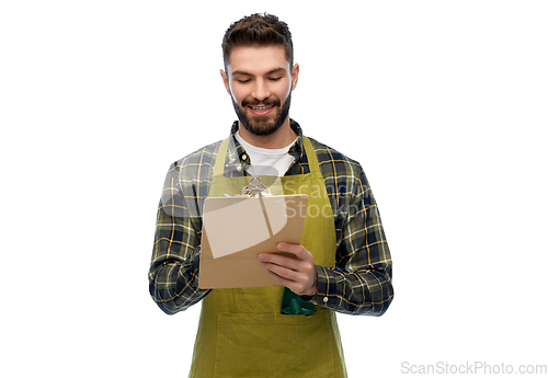 Image of happy male gardener with clipboard