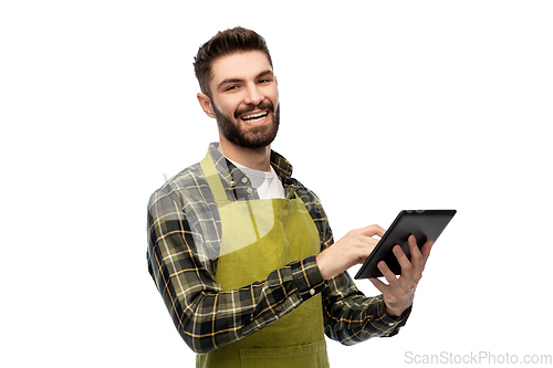 Image of happy male gardener or farmer with tablet pc