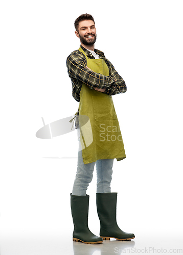 Image of happy gardener or farmer with box of garden tools