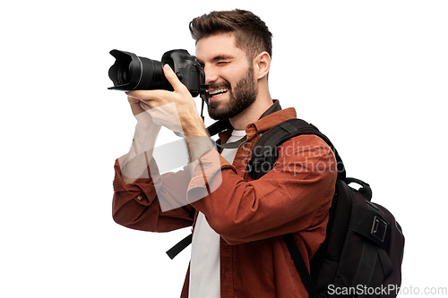 Image of happy man or photographer with camera and backpack