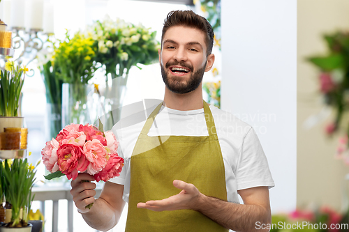 Image of smiling male florist or seller at flower shop