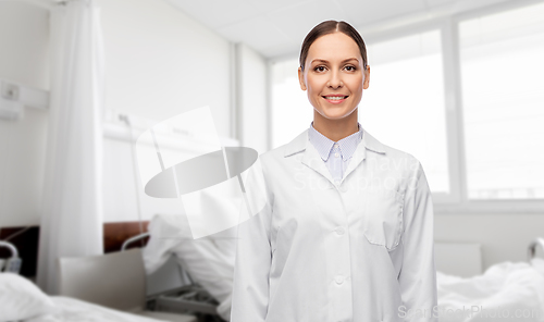 Image of smiling female doctor in white coat at hospital