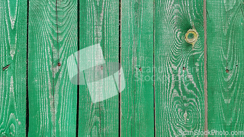 Image of Texture of weathered wooden green painted fence