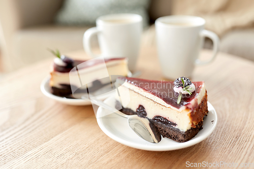 Image of piece of chocolate cake on wooden table