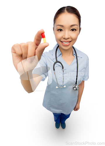 Image of asian doctor with medicine and glass of water