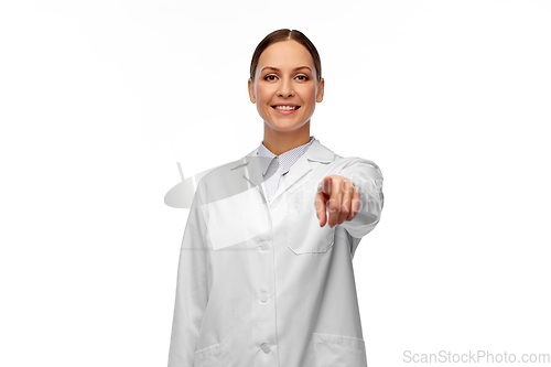 Image of happy female doctor pointing to camera