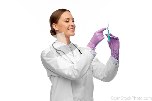 Image of happy female doctor with medicine in syringe