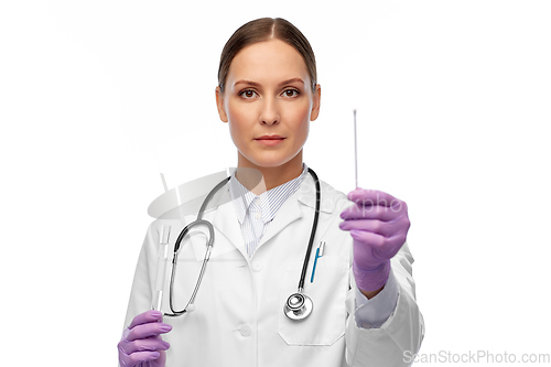 Image of female doctor with test tube and cotton swab