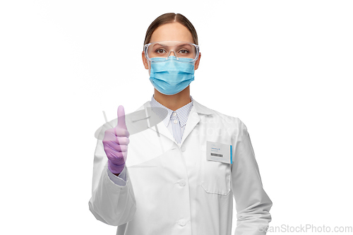 Image of female scientist in medical mask and goggles