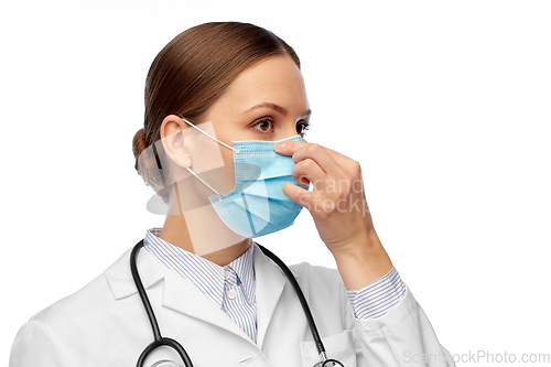 Image of happy female doctor wearing medical mask