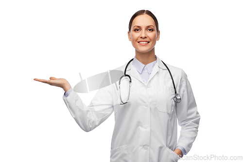 Image of happy female doctor holding something on her hand
