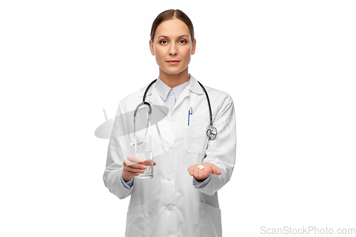 Image of doctor with medicine and glass of water