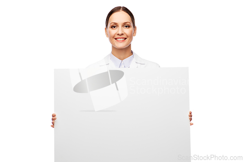 Image of happy smiling female doctor holding white board