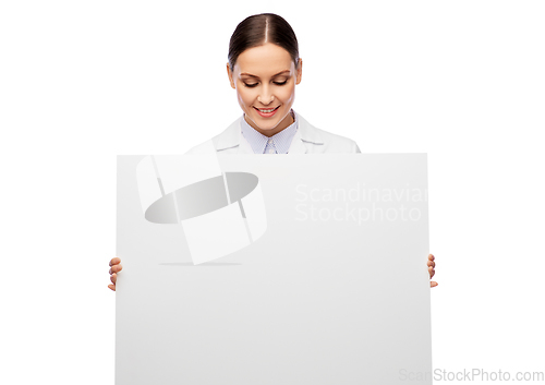 Image of happy smiling female doctor holding white board