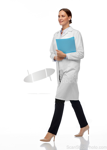 Image of female doctor or scientist walking with folder