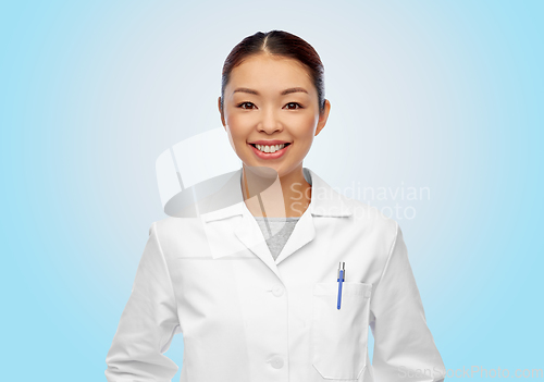 Image of happy smiling asian female doctor in white coat