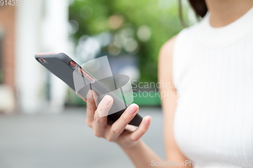Image of Woman holding a cellphone