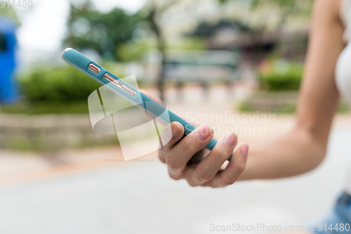 Image of Close up of using mobile phone
