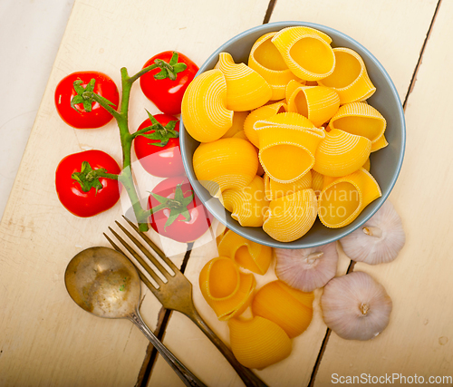 Image of Italian snail lumaconi pasta with tomatoes