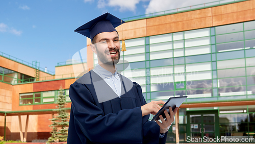 Image of male graduate student or bachelor with tablet pc