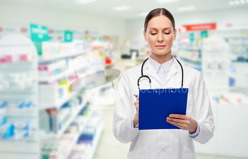 Image of doctor with clipboard and stethoscope at pharmacy