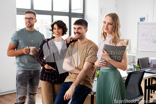 Image of happy business team at office